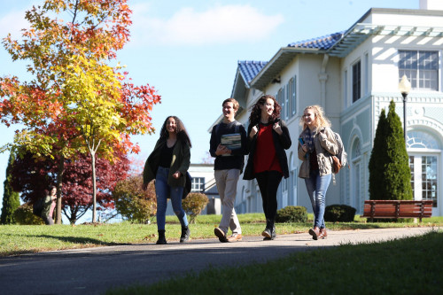 Students walking away from Roary hall in the fall